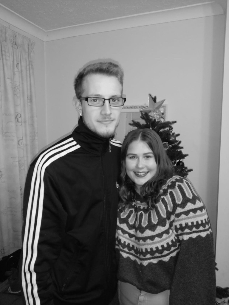 Bethanie-Taylor and Gregory by the Christmas tree